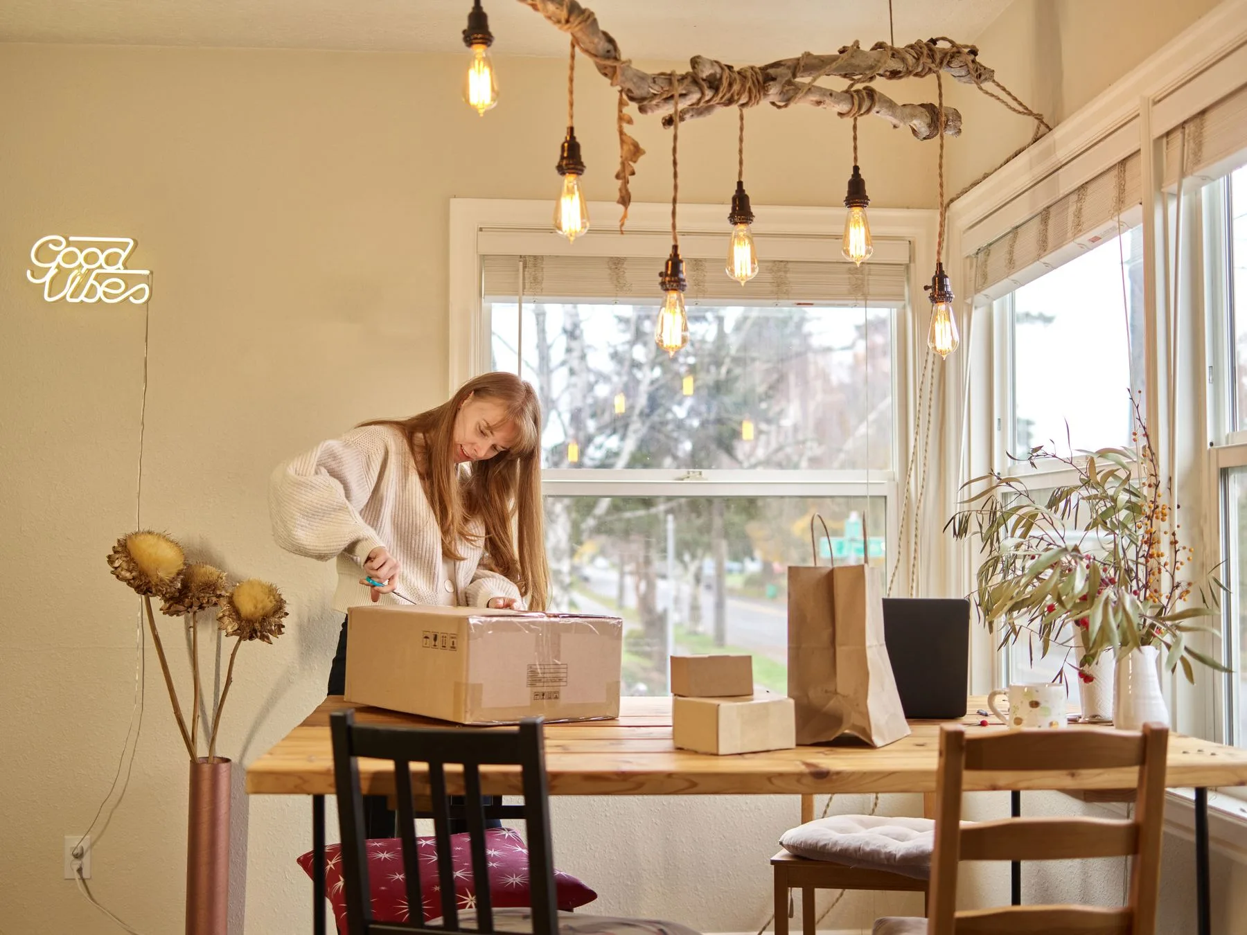 Shopper opening a delivered cardboard box at home