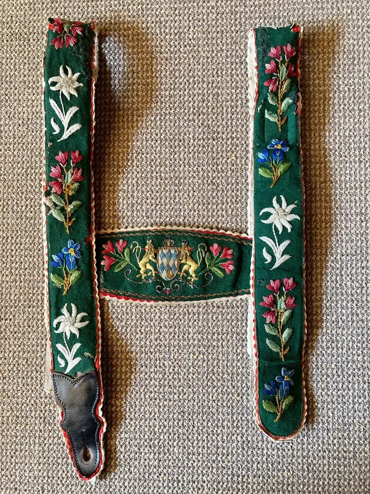 Embroidered green Bavarian suspenders with floral and edelweiss details